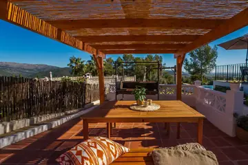 Covered dining area and charcoal barbecue